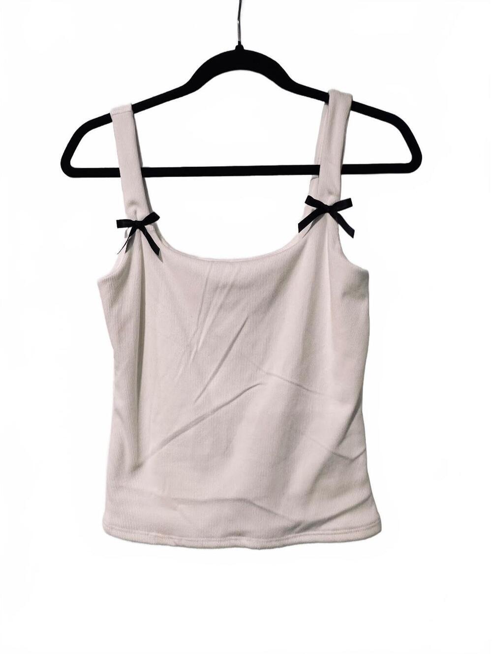 White ribbed tank top with black bows